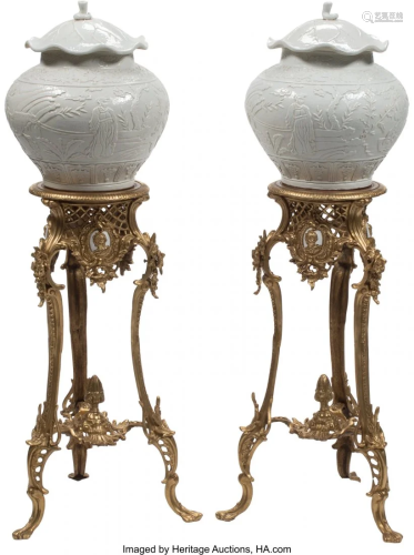 A Pair of Chinese Blanc-de-Chine Covered Urns wi