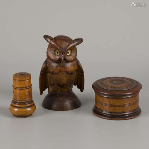 A (3)-part lot treenware comprising a turned inkwell, an owl...