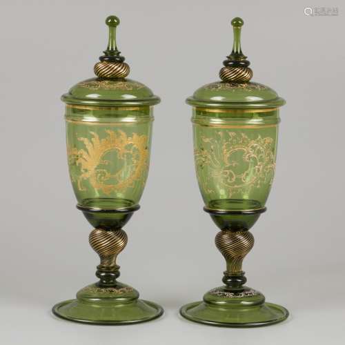 A set of (2) green glass lidded coupes, France, early 20th c...