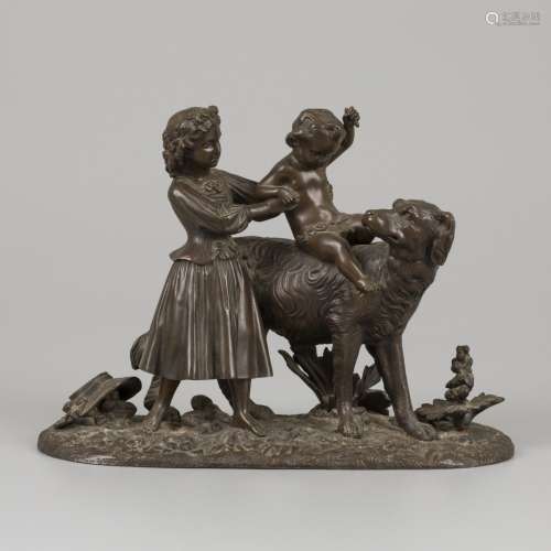 A bronze group of children playing with a dog, cast ca. 1900...