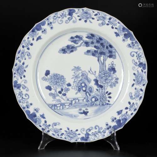 A porcelain dish with floral decor on the outside edge and i...