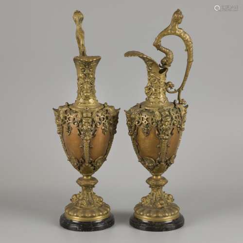 A pair of bronze claret jugs with cast bronze mounts, ca. 19...