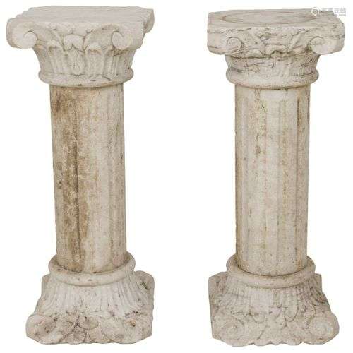 A set of (2) marble columns with Corinthian capital.