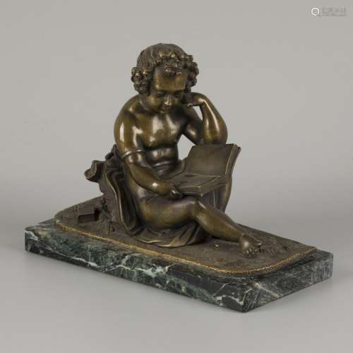 A cast bronze of a putto reading, ca. 1900.