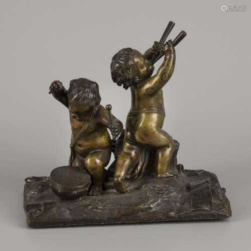 A bronze group with putti playing instruments.