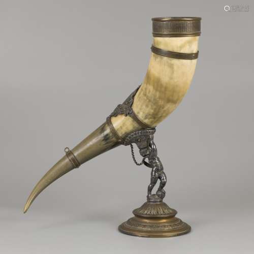 A drinking horn made of an ox horn, carried by a putto, ca. ...