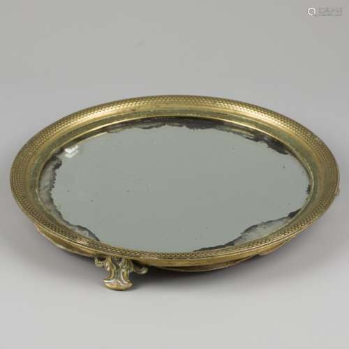 A bronze cabaret with mirror glass, early 19th century.