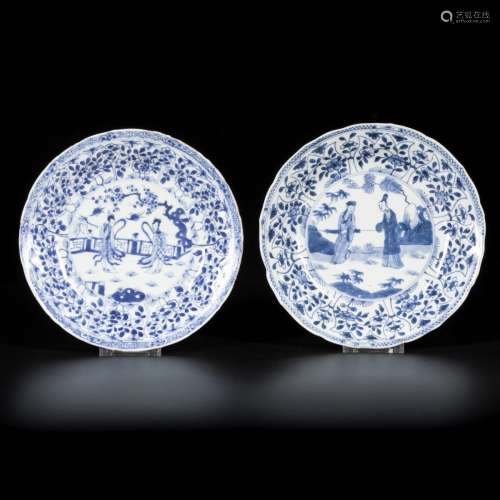 A lot comprised of (2) porcelain plates with figures decorat...