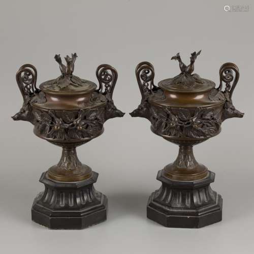 A set of chimney vases decoratred with boar heads and beechn...