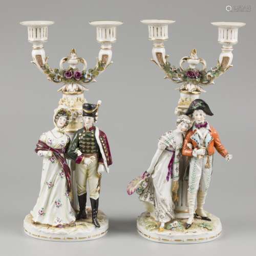 A set procelain candles with depiction of a lady and a gentl...