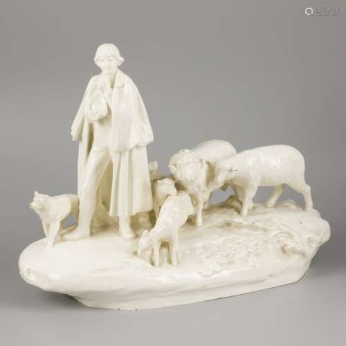 A pale white earthenware sculptural group, shepherd with flo...