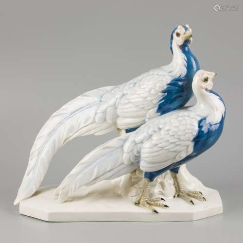 A porcelain sculpture group of a pair of gold pheasants, mar...