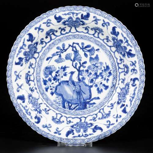 A ribbed porcelain plate with decor of bird on rock, China, ...