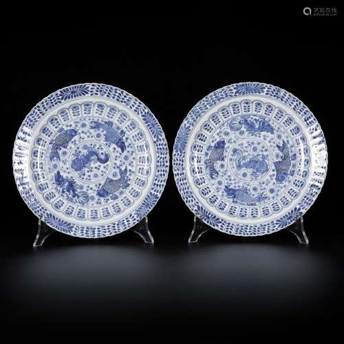 A set of (2) porcelain plates with carp decor, marked Kangxi...