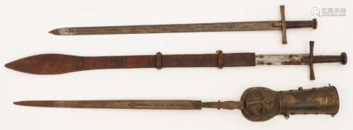 A lot with (3) various swords, a.w. (2) touareg swords, Nort...
