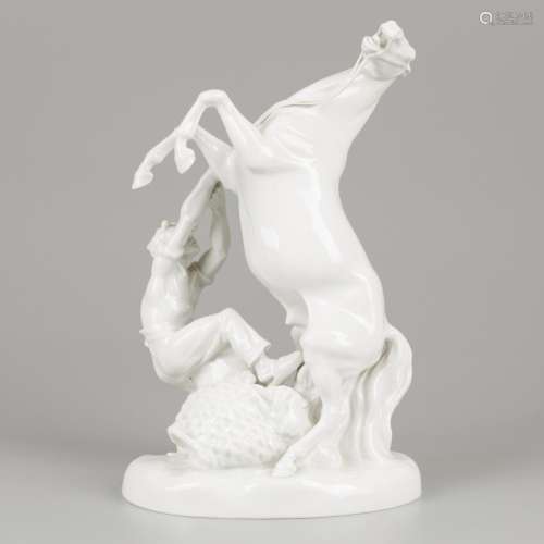 A porcelain equestrian group of a stallion and groom, Erich ...