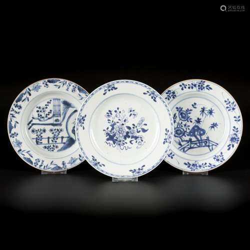 A lot comprising (3) porcelain plates with floral decoration...