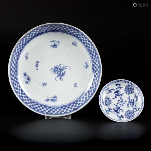 A deep porcelain plate and one saucer with floral decoration...