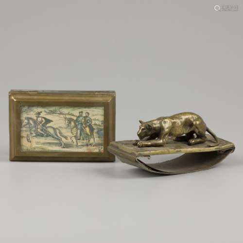 A bronze cast blotter with lurking lioness, together with a ...