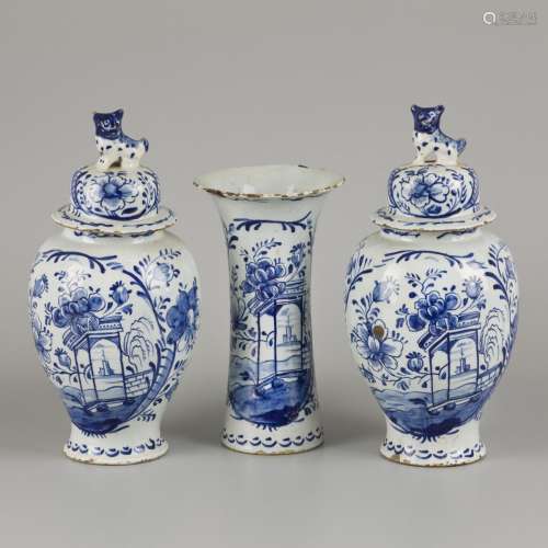 An earthenware garniture set decorated with floral motifs, D...