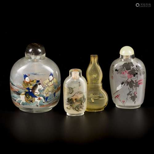 A lot comprised of (4) glass snuff bottles with various deco...