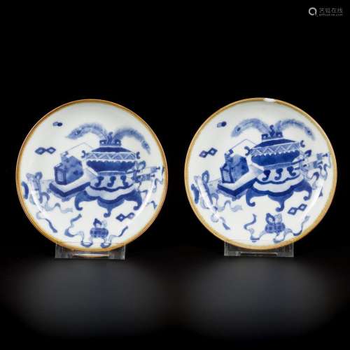 A set of (2) small porcelain saucers decorated with antiquit...