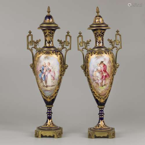 A set of (2) porcelain vases with bronze mounts, Chateau des...