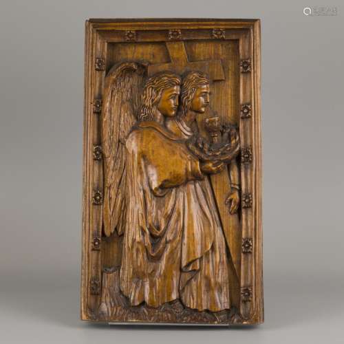 An carved oak bas-relief depicting St. john the Baptist with...