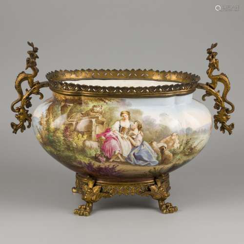 An earthenware jardiniere with bronze frame decorated with a...