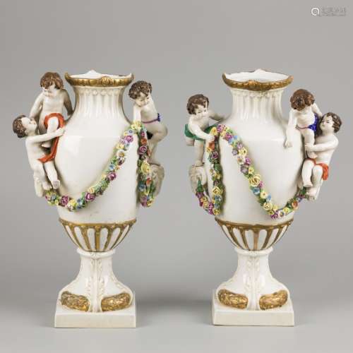 A set of (2) porcelain vases decorated with flowers, ram hea...