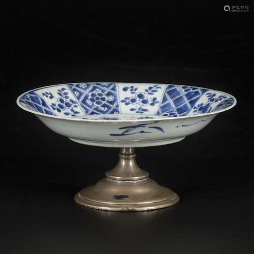 A porcelain plate on a silver base, China, Kangxi.