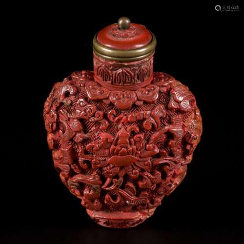 A lacquerwork snuff bottle with floral decoration and ruyi, ...