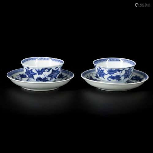 A set of (2) porcelain cups and saucers with floral decorati...