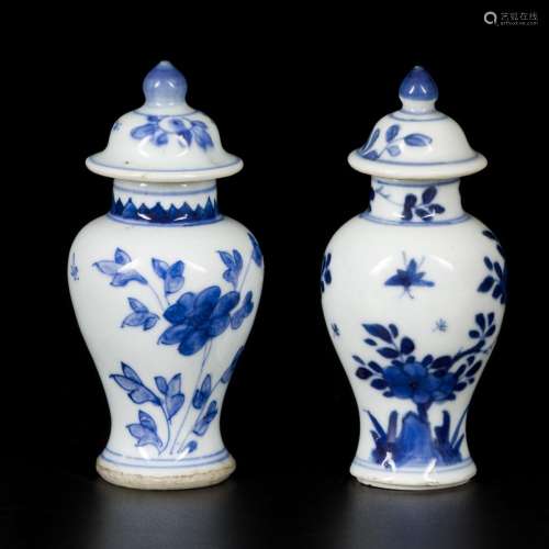 A lot comprising (2) porcelain lidded vases with floral deco...