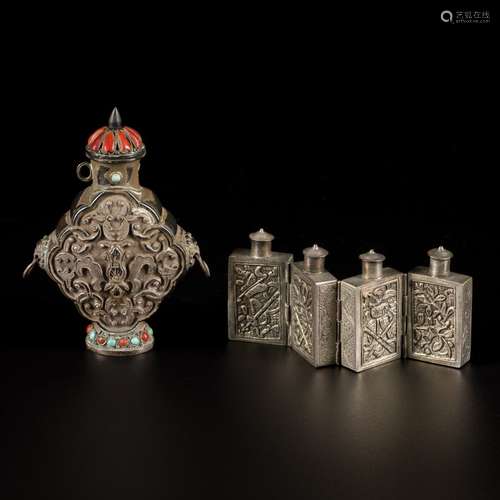 A lot comprising (2) Tibetan silver snuff bottles with flora...