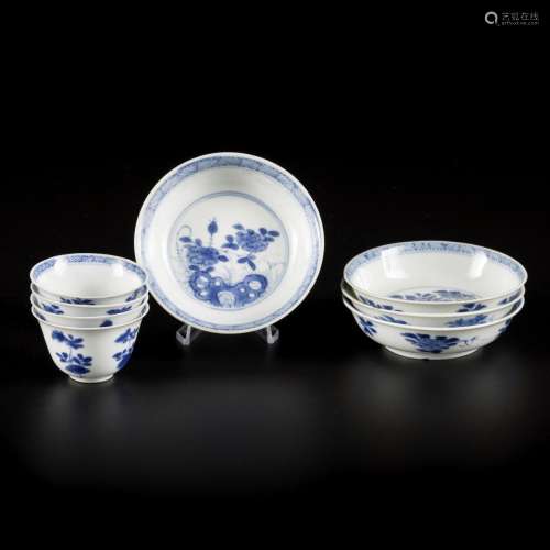 A set of (4) porcelain miniature cups and saucers with flora...