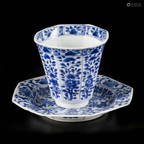 A porcelain angled 8-sided cup and saucer with floral decor,...