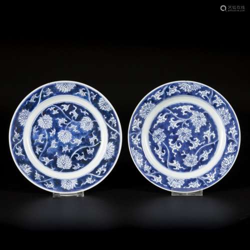 A set of (2) porcelain plates with lotus decoration in rever...