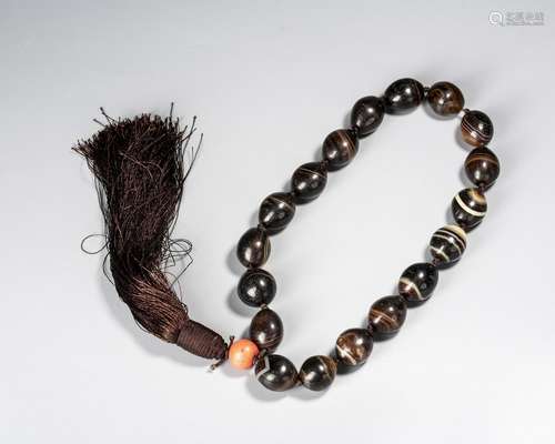 A Chinese String Of Diz Beads