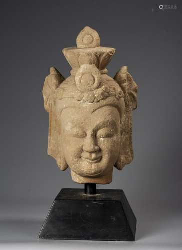 A Chinese Carved Limestone Fragmentary Head Of