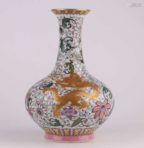 A QianLength famille-rose enamelled vase with a dragon desig...