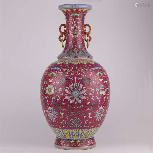 A large QianLength carmine enamelled floral vase with gilt-p...