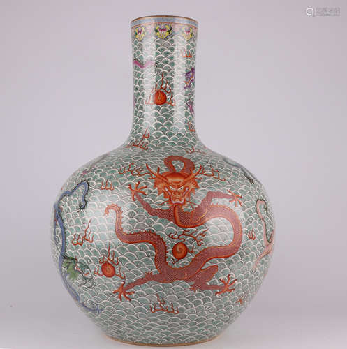 A QianLength famille-rose enamelled vase with a seawater dra...