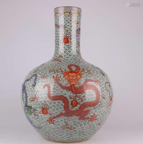 A QianLength famille-rose enamelled vase with a seawater dra...