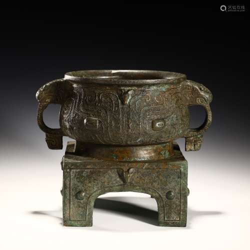 Ancient bronze tripod with animal ears