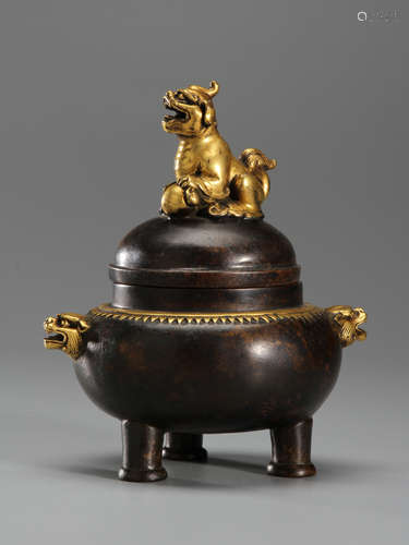 Gilded bronze three-legged furnace with beast ears