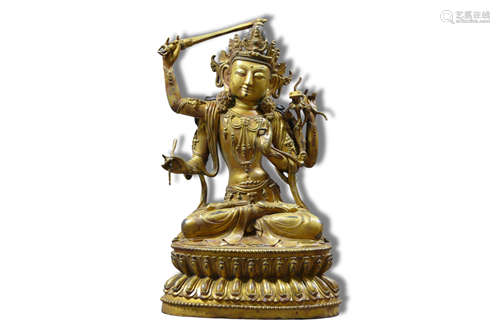 A Four Armed Manjusri Gilt Bronze Figure Statue