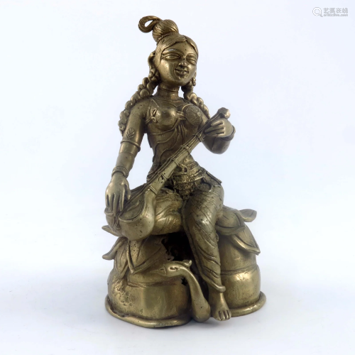 An Indian cast brass figure of a female