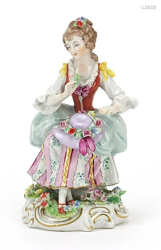 German porcelain figure of a lady with a hat on her