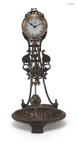 Patinated bronze mystery clock with ring tray, 28cm